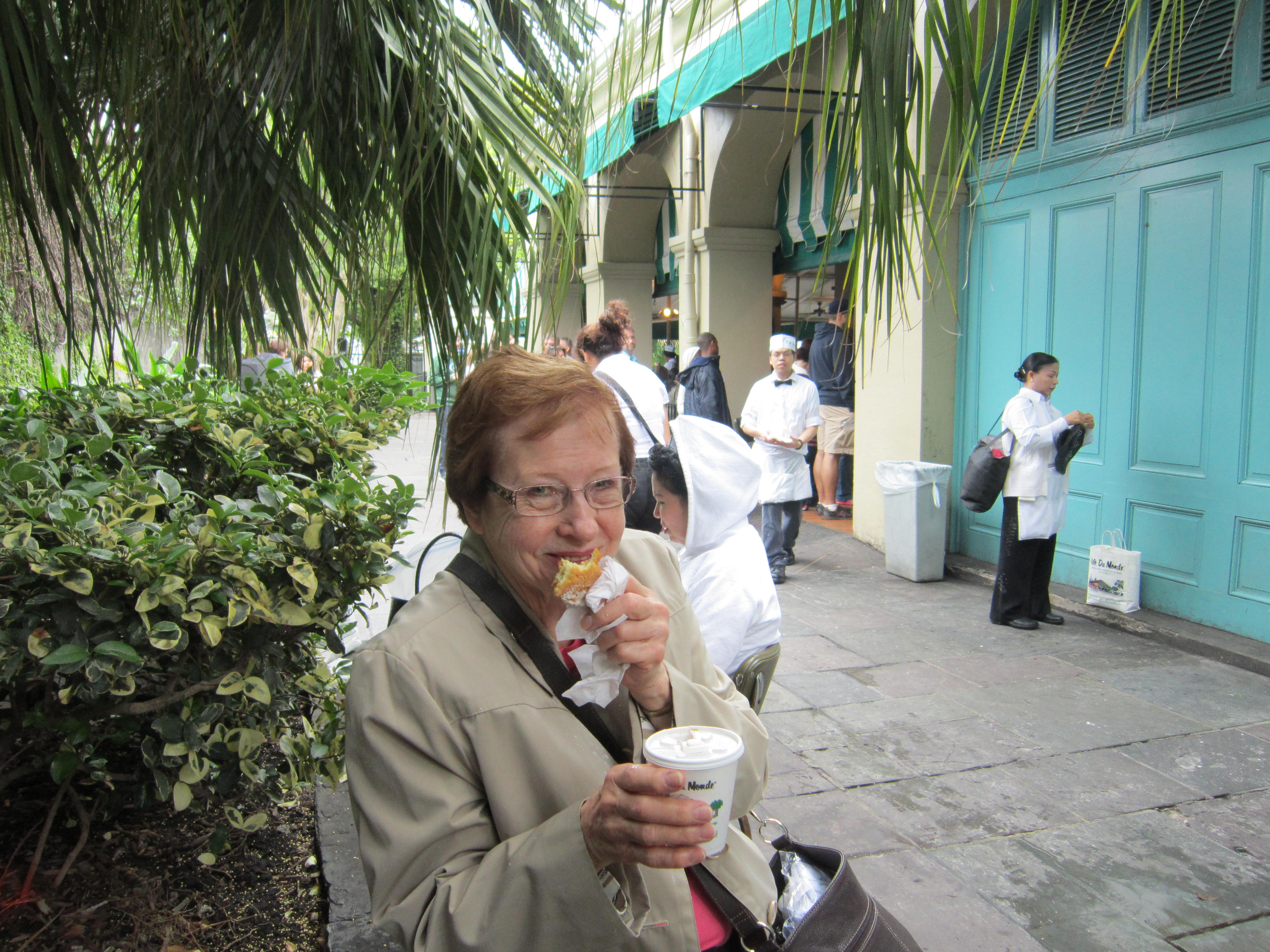 Betty enjoys the beignet from Cafe' Du Mond