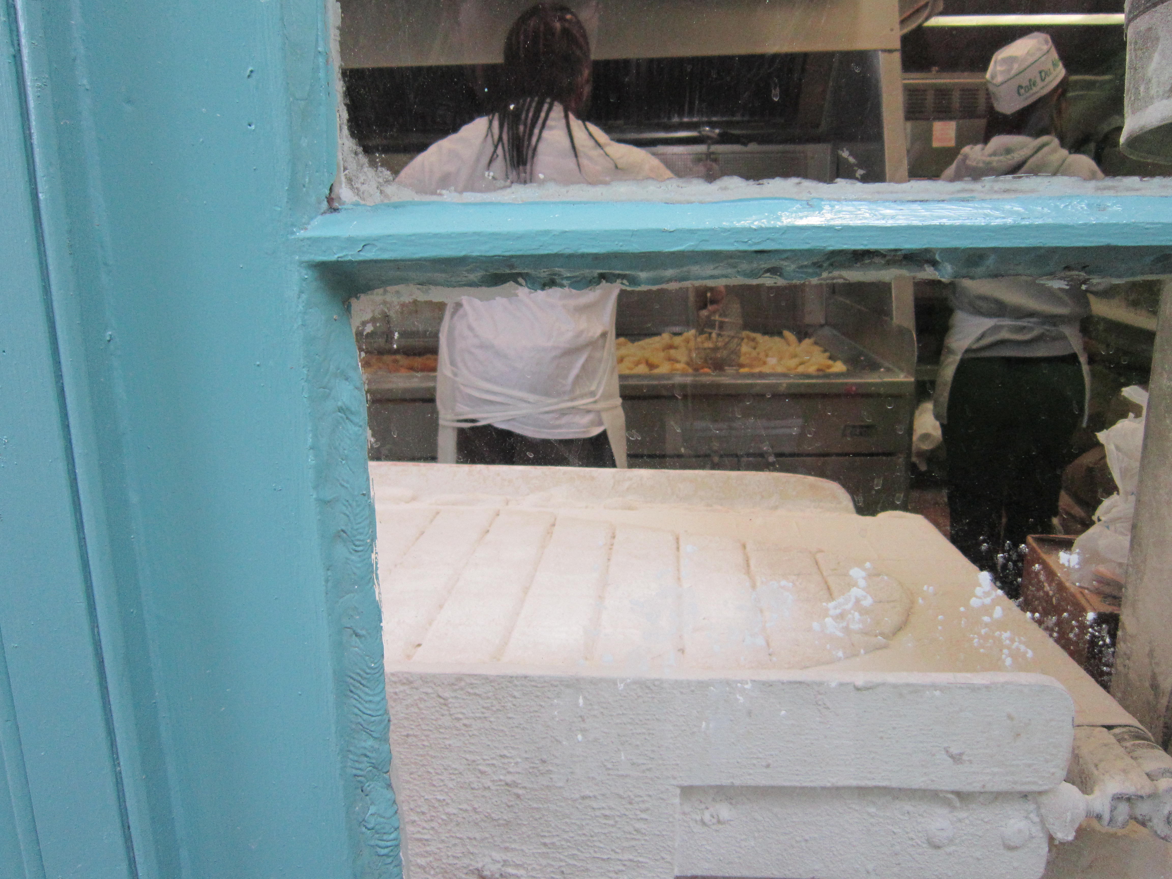 Making beignets at Cafe' Du Mond - French Quarter